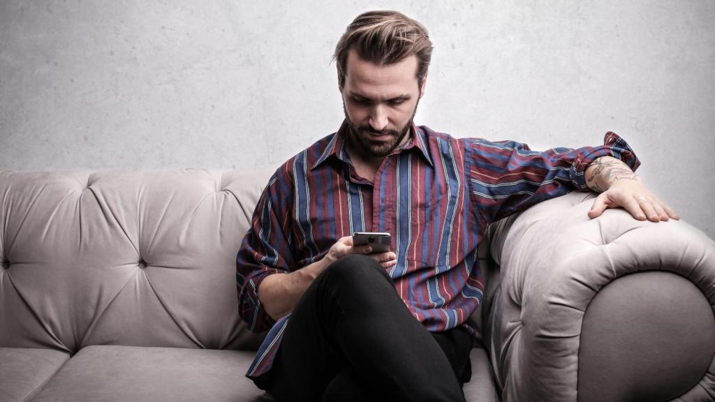 Man reading text messages on his phone