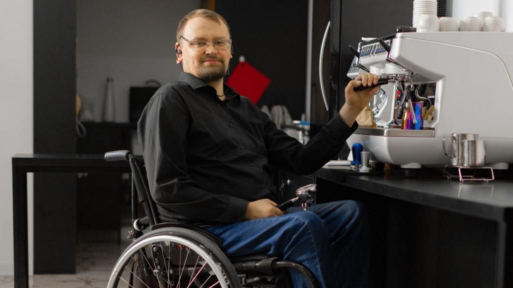 Man in wheelchair making coffee