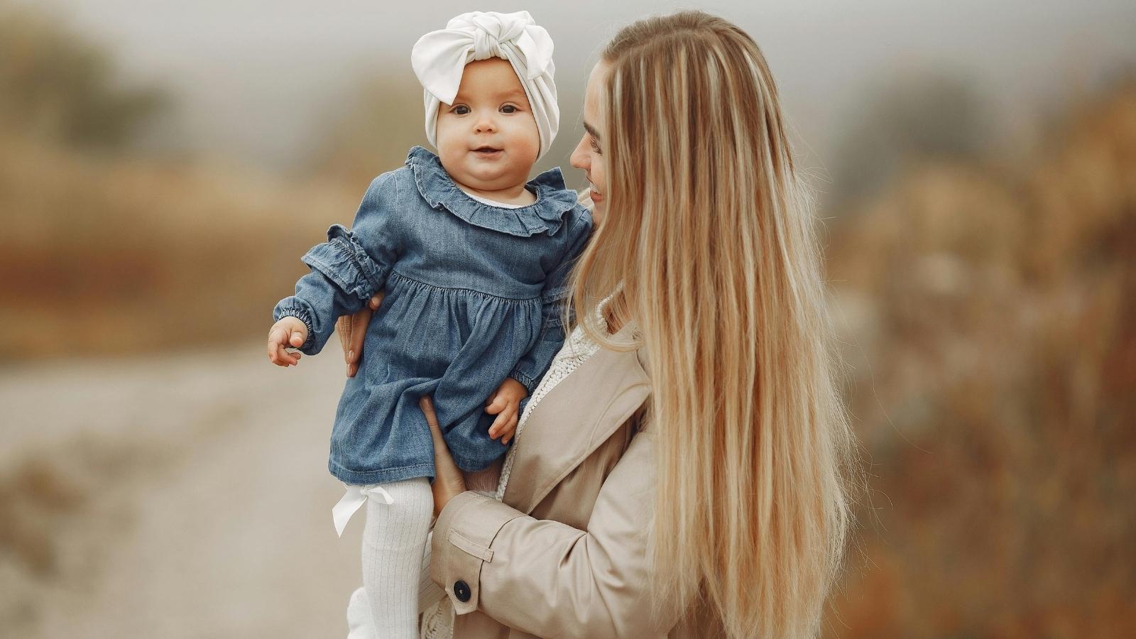 Woman Names Daughter After Grandmother, but Sister in Law Accuses Her of Stealing the Name Young mother holding her little daughter