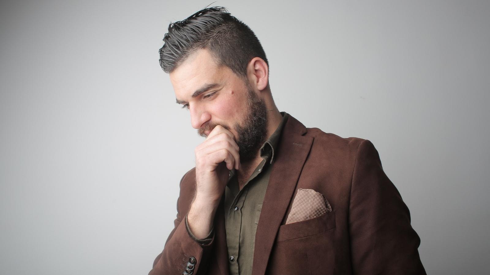 Groom Bans All Spouses From Small Wedding—Now a Wife Claims Her Husband Going Disrespects Their Marriage Man thinking about what to do