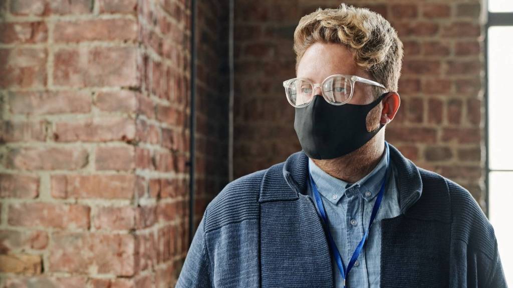Hotel employee wearing a mask during COVID