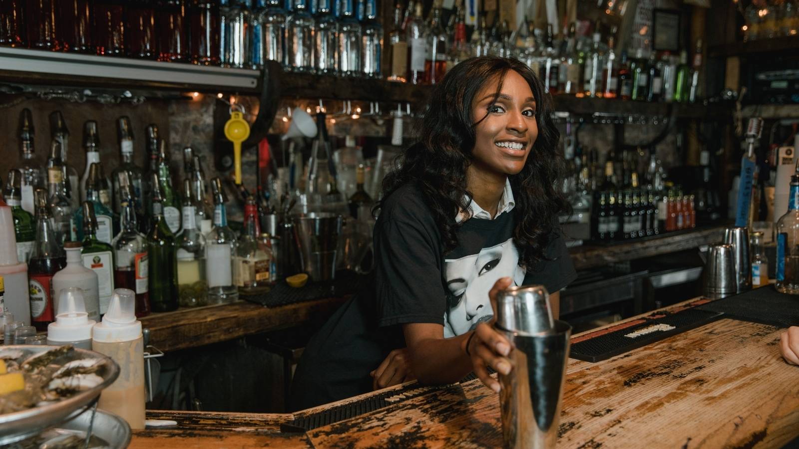 Bartender Loses Patience After Customer Refuses to Leave and Threatens to Call the Owner woman bartender working a closing shift.