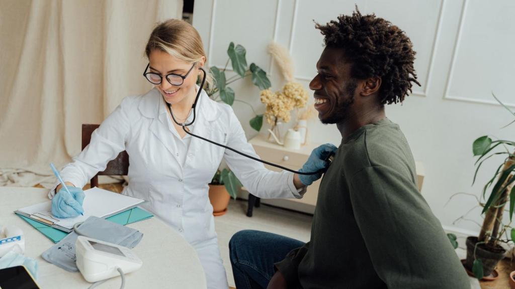 Man getting vitals taken by a nurse