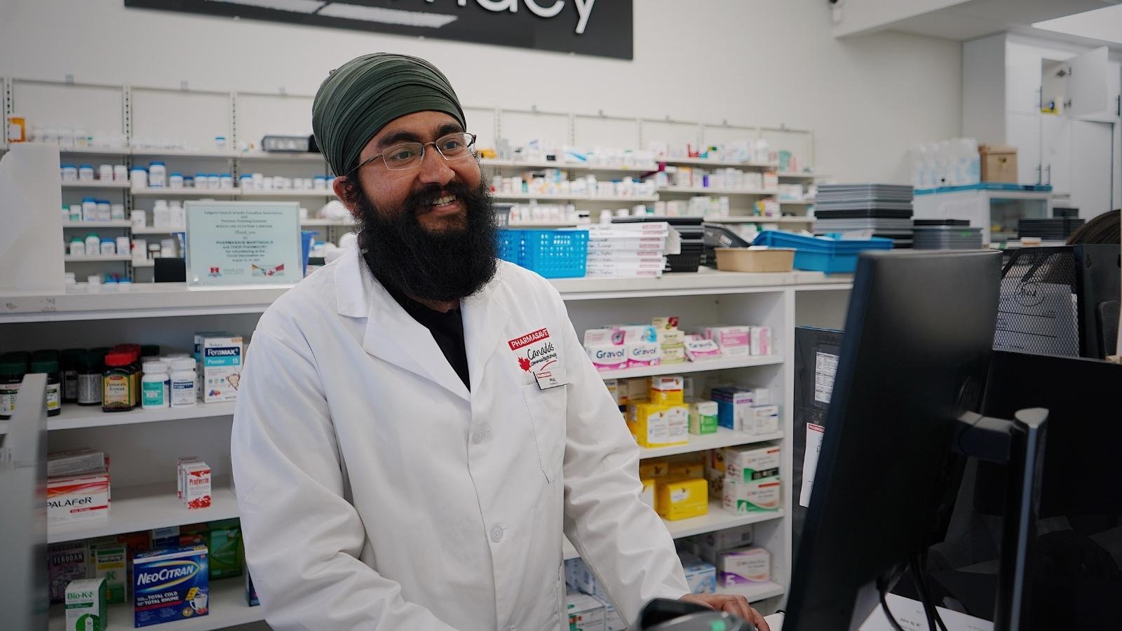 Pharmacist smiling at a customer