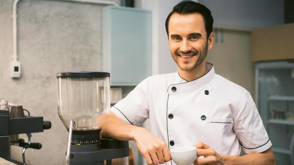 Man smiling because he walked out of his restaurant job