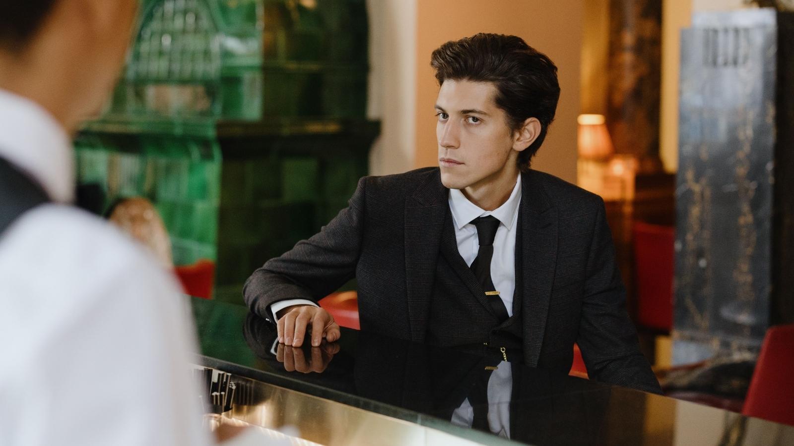 Hotel customer at the front desk with the clerk