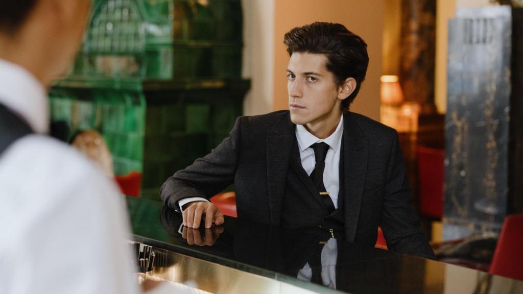 Hotel customer at the front desk with the clerk