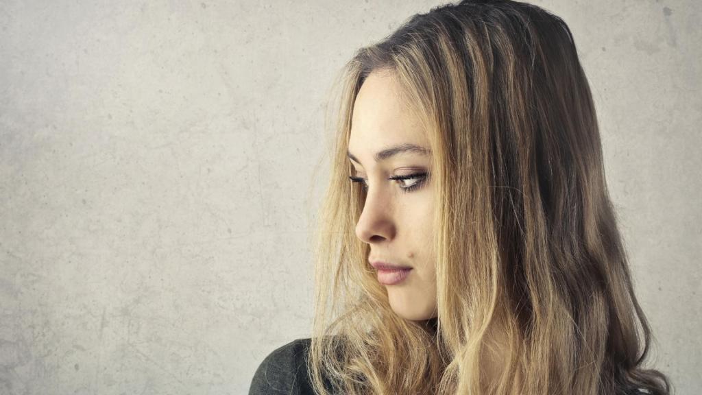Young woman thinking about a family gathering