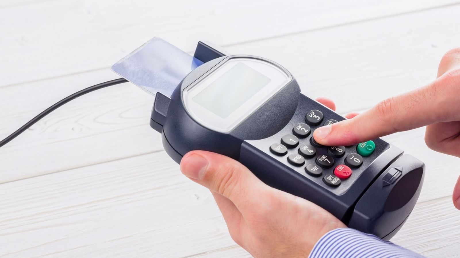 Cashier Left Utterly Bewildered After Stubborn Customer Refuses to Take His Own Cash man paying with credit card on a pin pad
