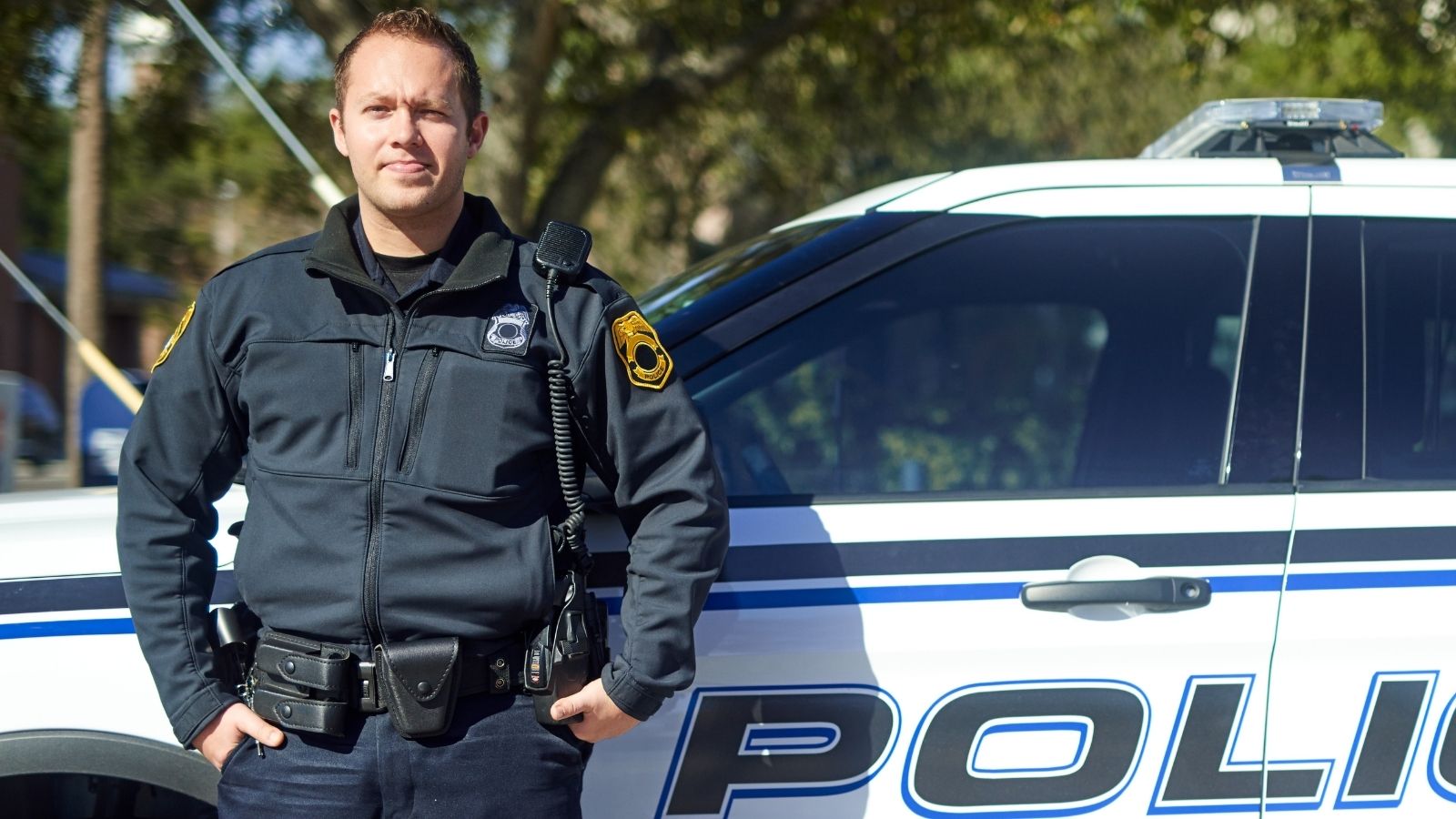 police officer standing outside his vehicle