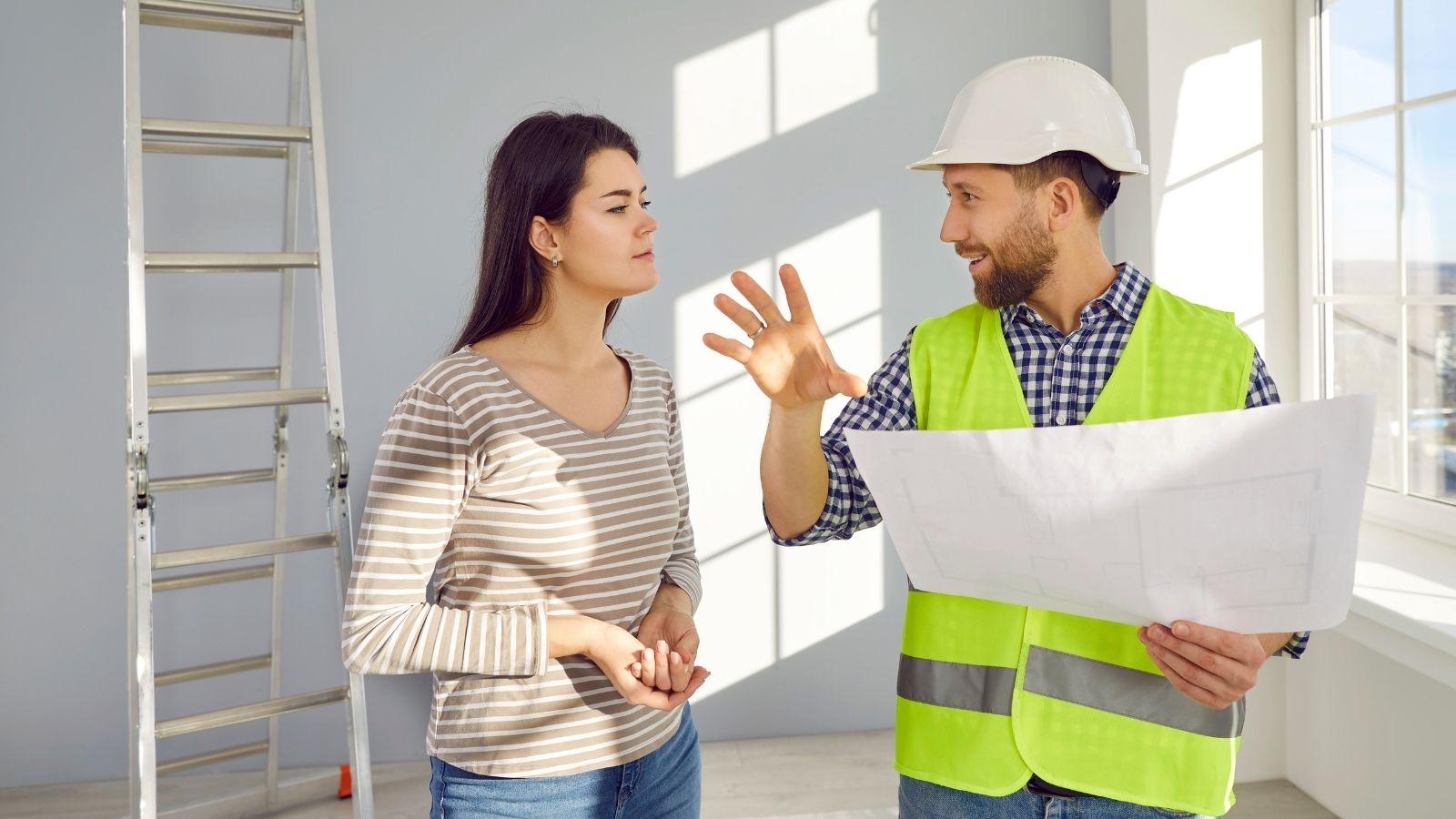 contractor talking to skeptical female homeowner