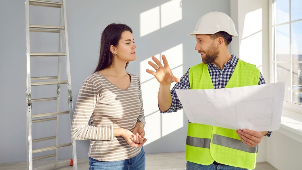 contractor talking to skeptical female homeowner