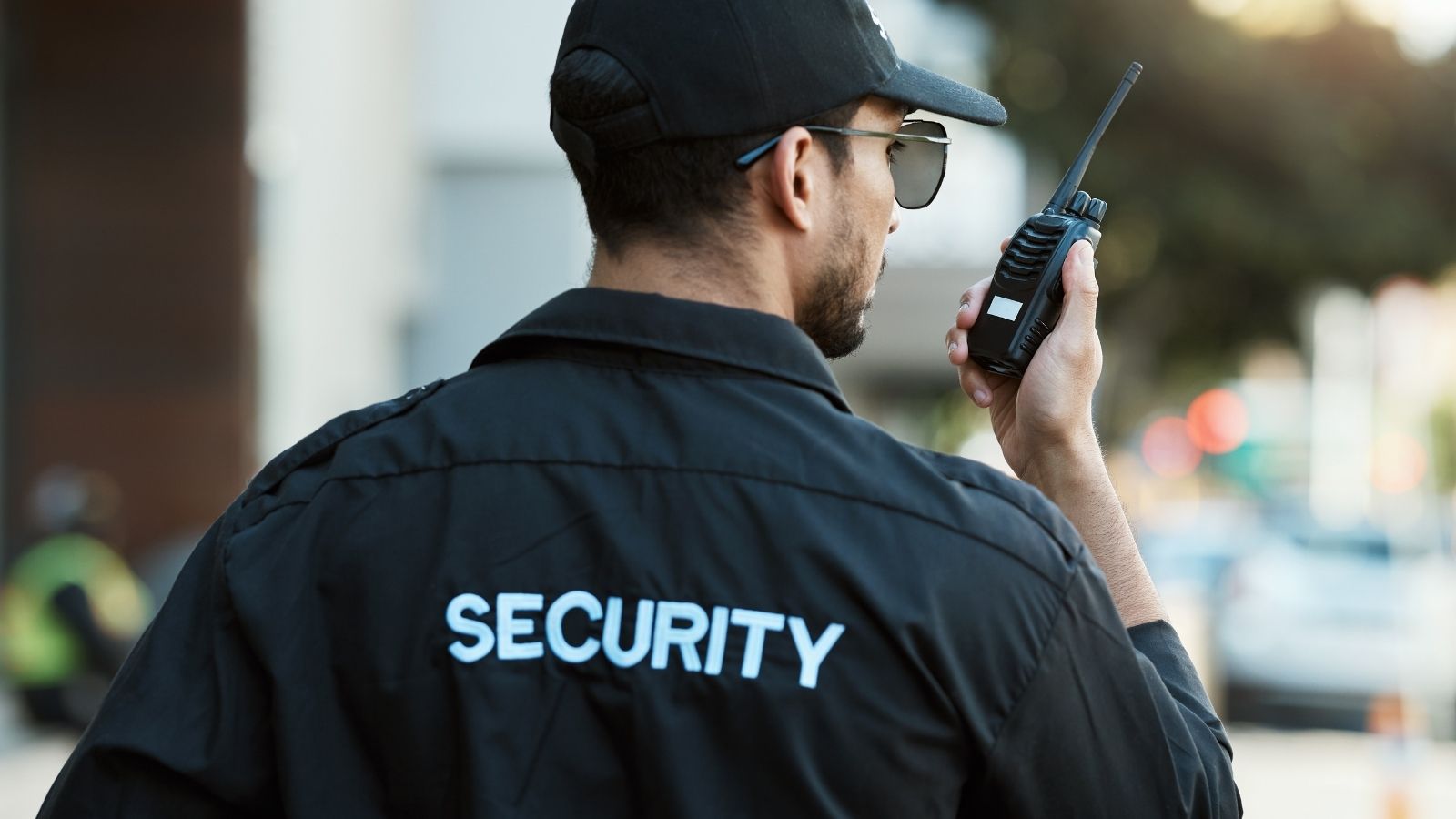 security guard talking into a radio