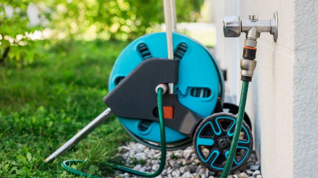 hose on a hose reel outside a house