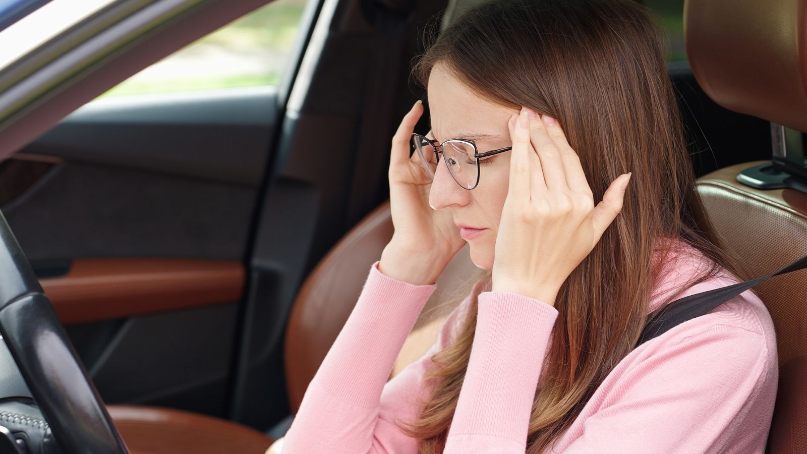 The Petty HOA Parking Dispute That Turned an Entire Neighborhood Against One Couple frustrated woman sitting in drivers seat