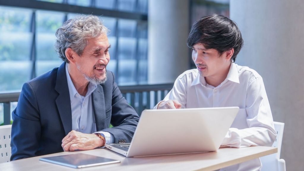 college student meeting with professor