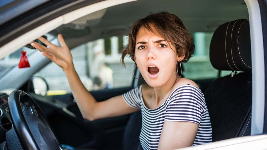 frustrated woman driving a car