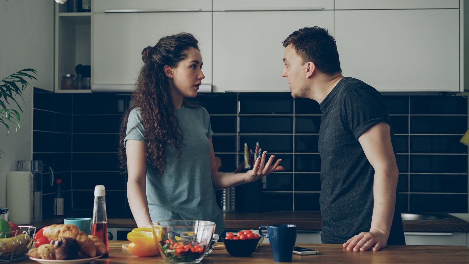 Shes Upset Her Husband Works Overtime Without Extra Pay — He Says She Doesnt Understand Salaried Jobs couple arguing in the kitchen