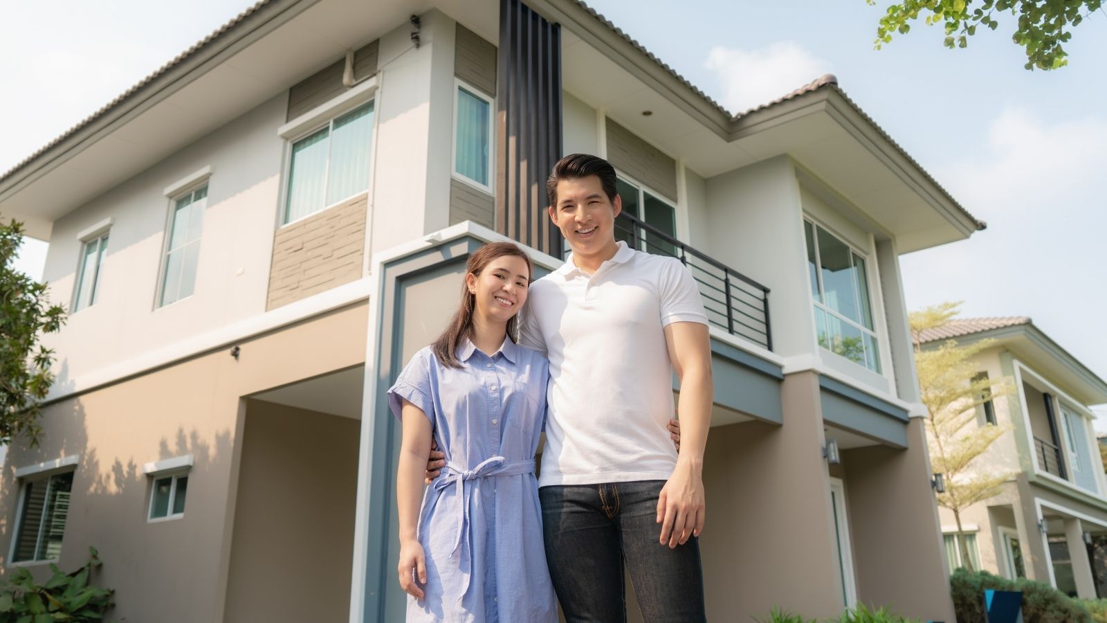 HOA Sent a New Homeowner a Violation Letter — They Dug Into the Rules and Removed the Board happy young couple standing in front of their house