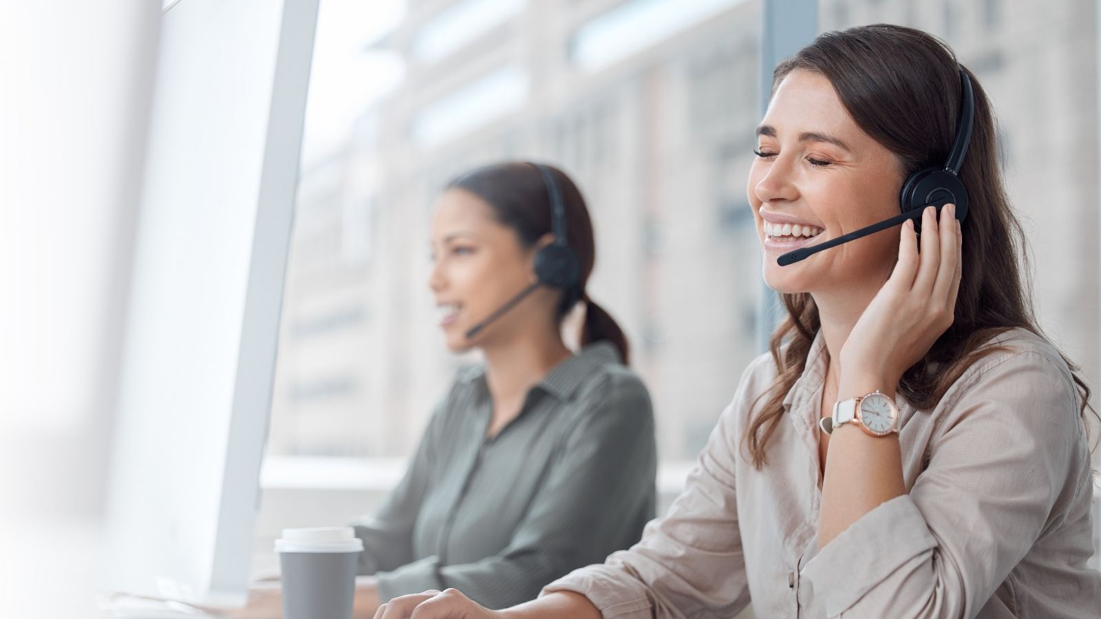 A Customer Tried to Charge a Company for His Time on the Phone—But His Plan Instantly Backfired woman at a call center laughing