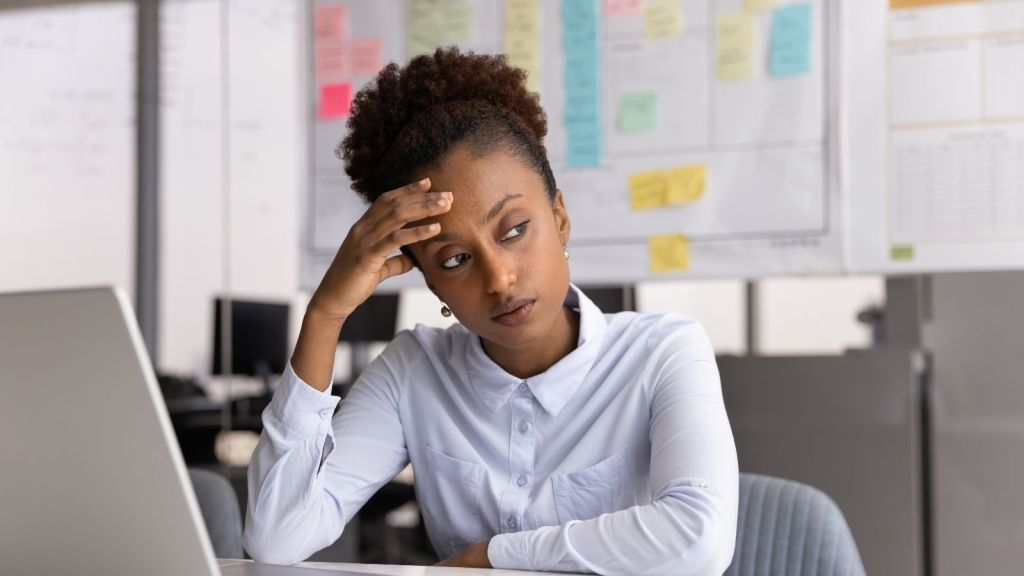 upset businesswoman at her desk