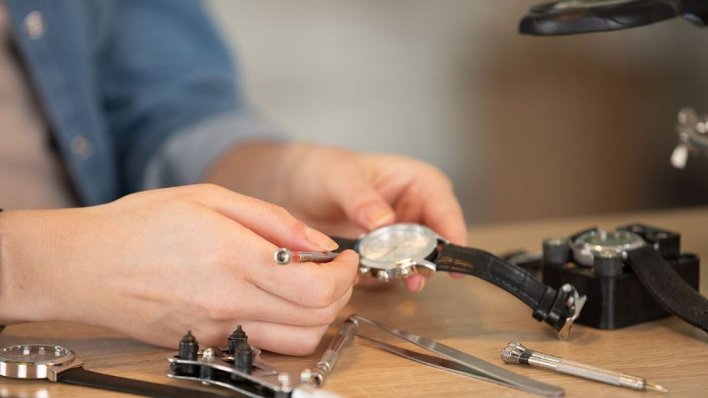 watch repair employee working on a watch