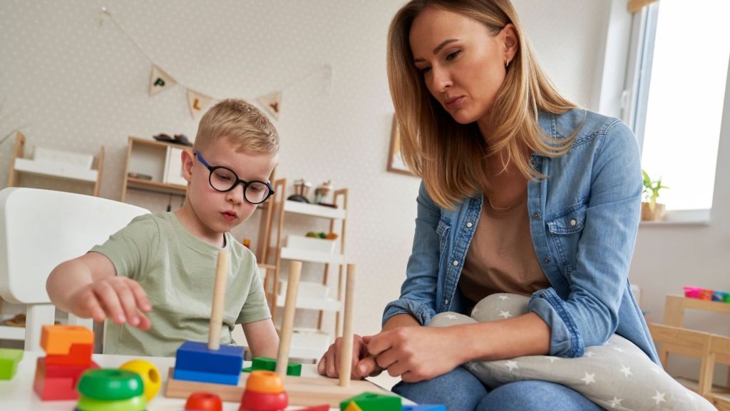 special education teacher working with student