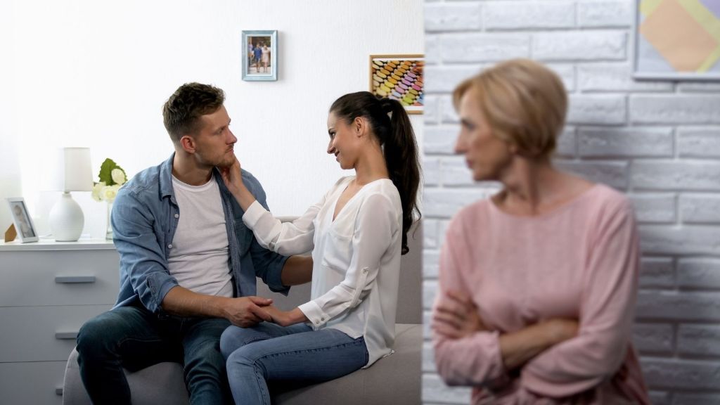 concerned mother spying on young couple