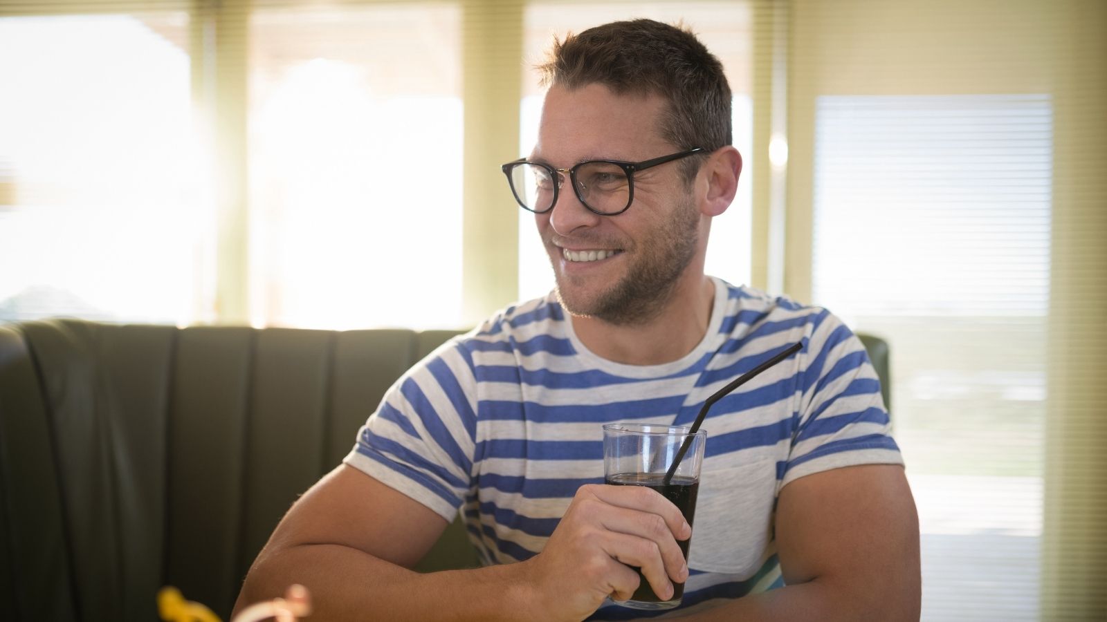 Her Customer Was Seeing His Dad for the First Time in 14 Years, But She Watched Him Wait And His Dad Never Showed Up happy man drinking soda in a restaurant