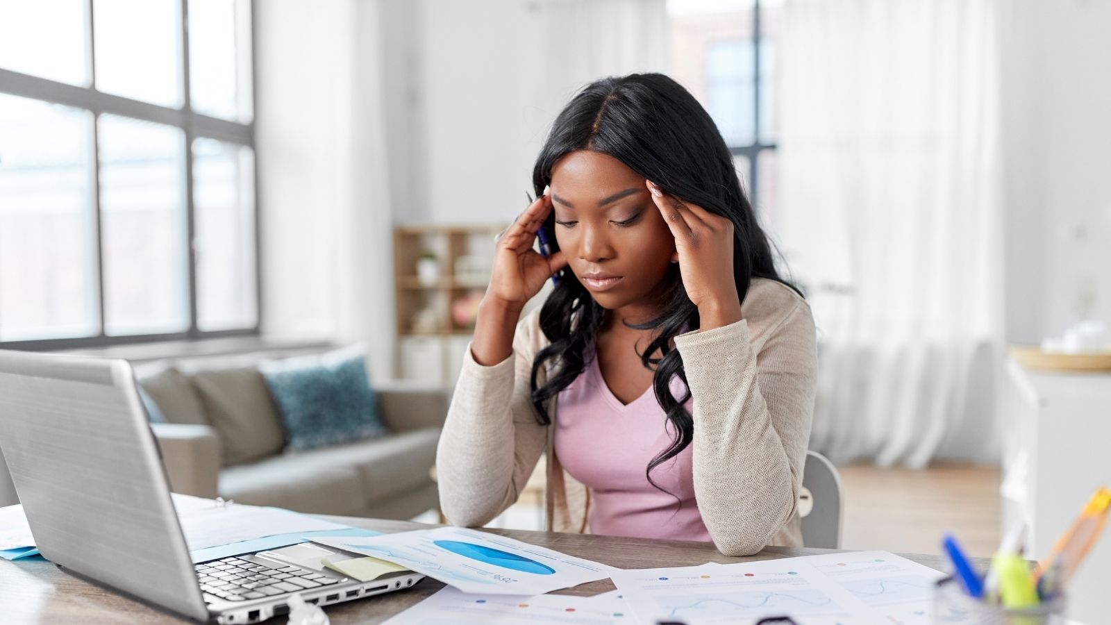 stressed out young woman working from home