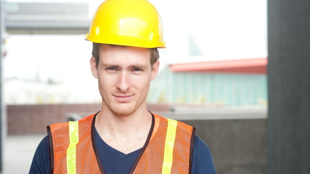young man in a yellow hard hat