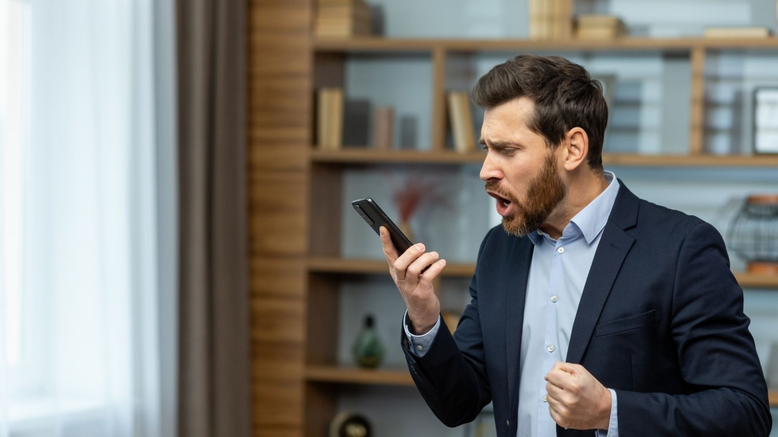 angry businessman talking on the phone
