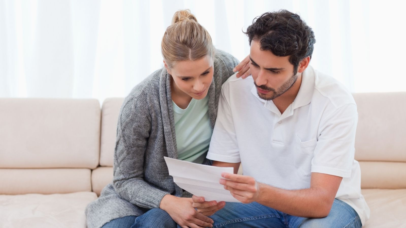 couple reading a letter