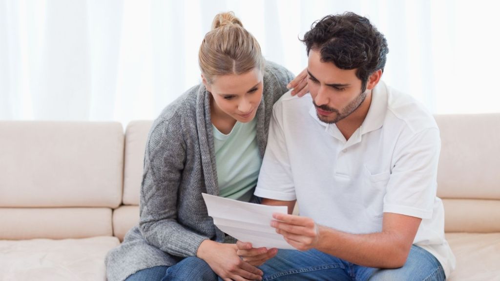 couple reading a letter