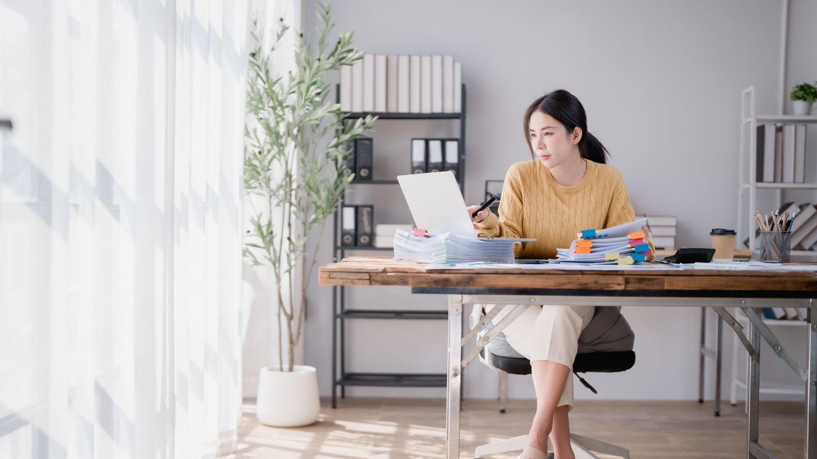 young woman working at a desk