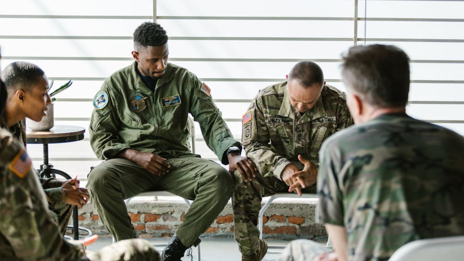 Military Trainee Stays in His Group Despite Being Treated Poorly, Leading to Unexpected Payoff Group of soldiers listening to and consoling each other