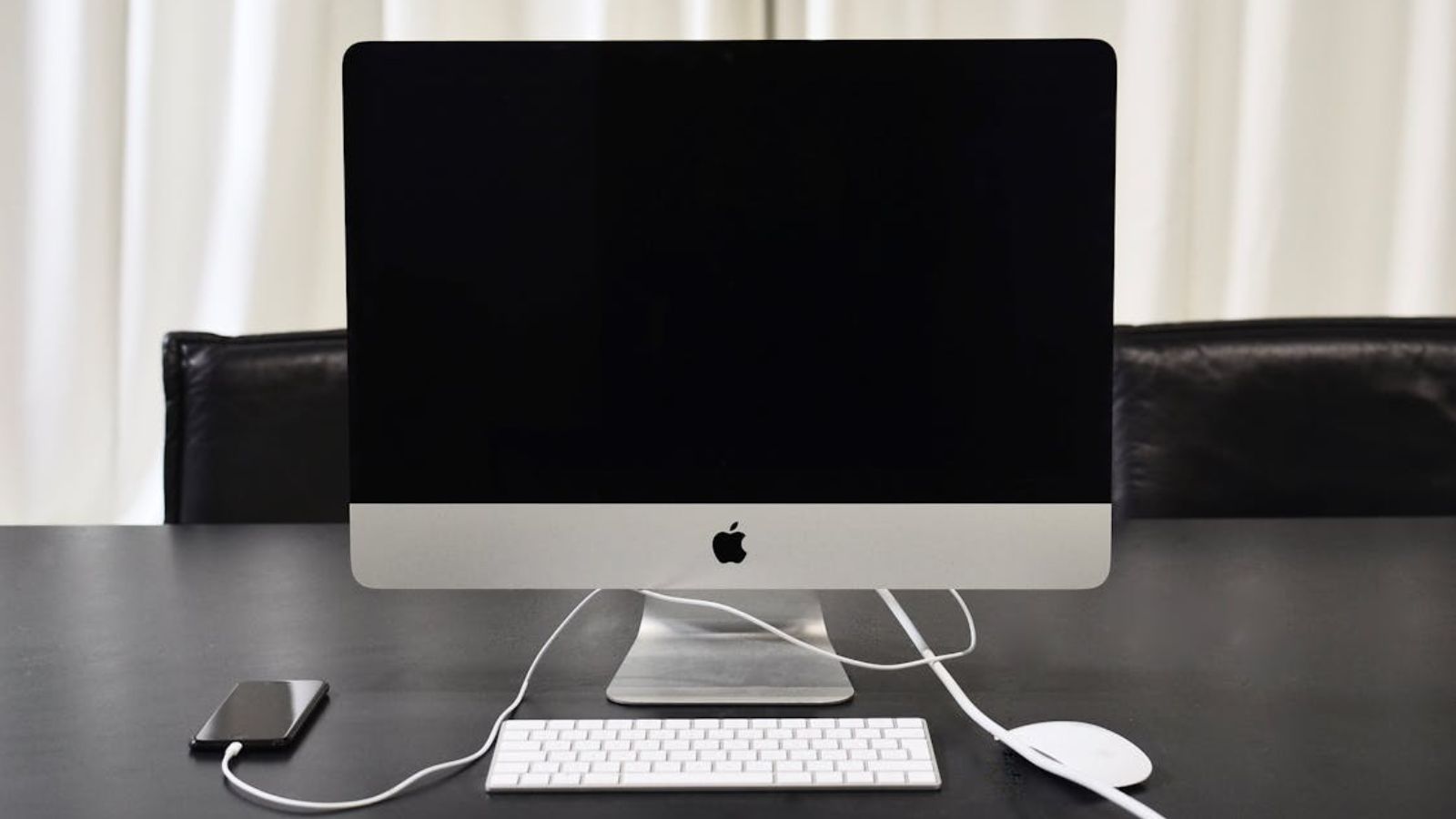 An IT Worker Logged On Early to Fix a Simple Email Glitch—and Uncovered an Active, Company Wide Cyber Attack A desktop monitor on a table turned off