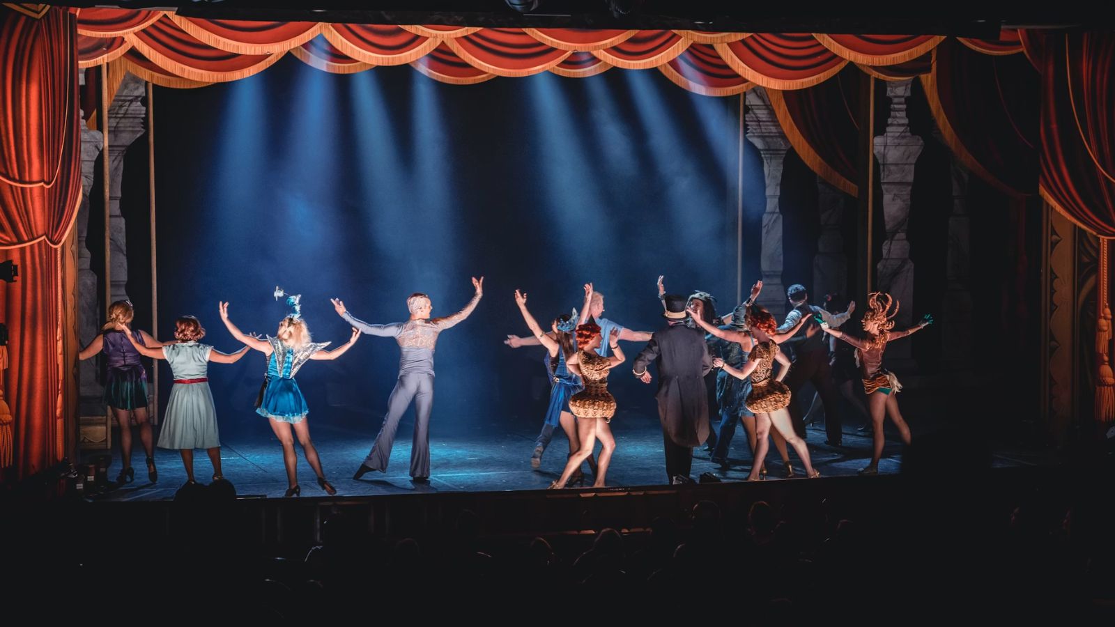 Theater artists performing on stage