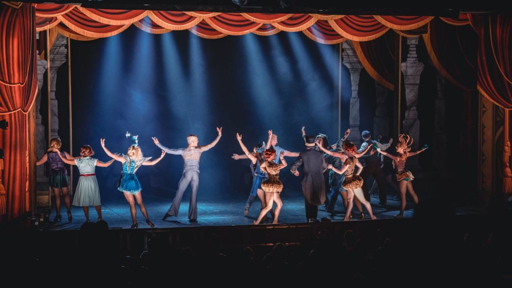 Theater artists performing on stage
