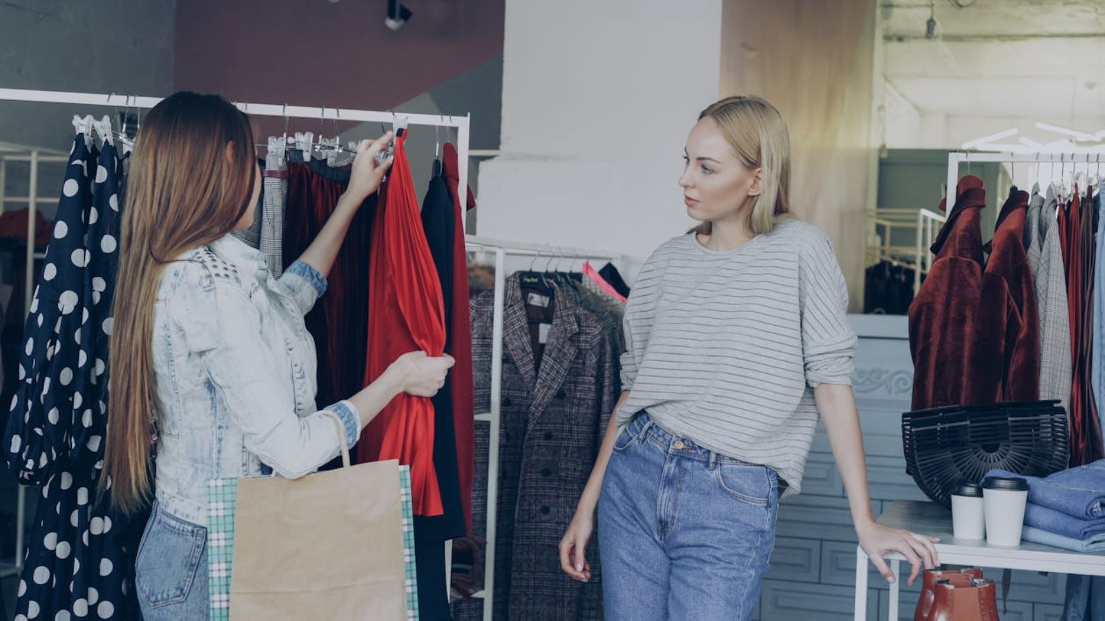 Two women shopping for dresses