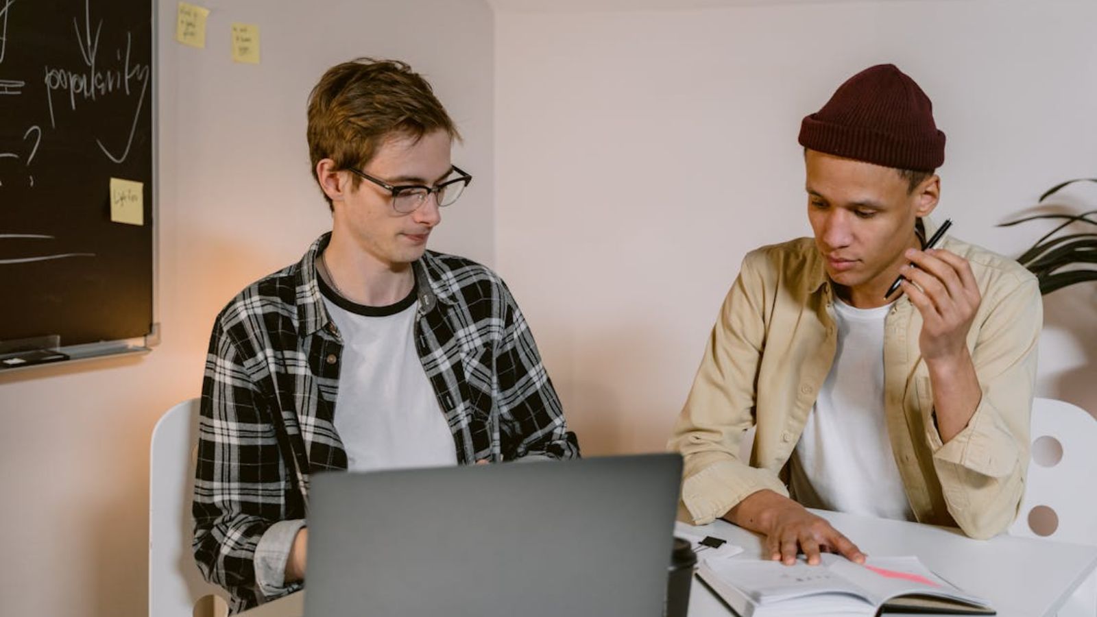 Man Stuck With a Low Paying Startup Job Despite His Familys Pressure — and It Changed Everything Two men having a serious conversation about work