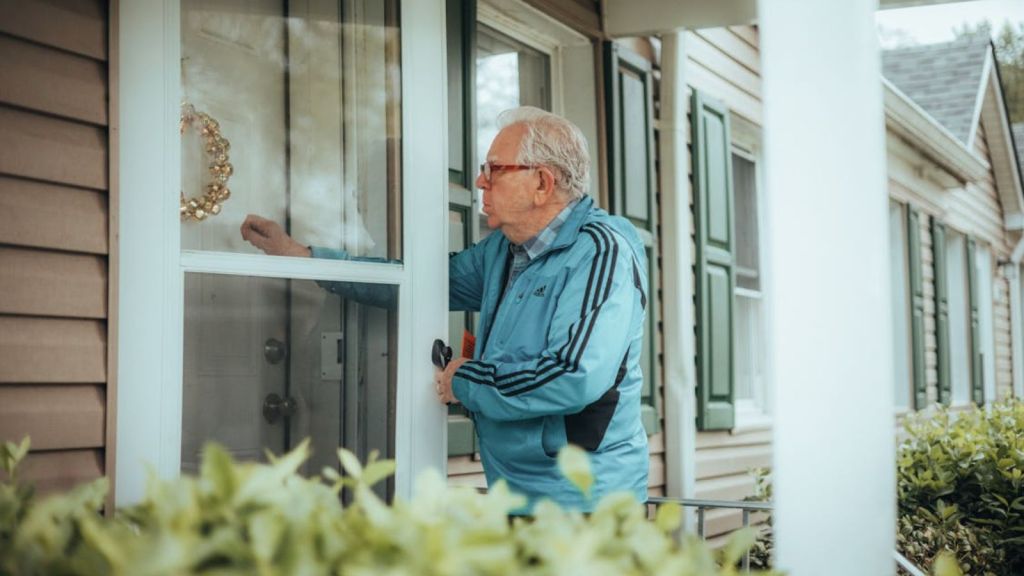 An old man knocking on the door