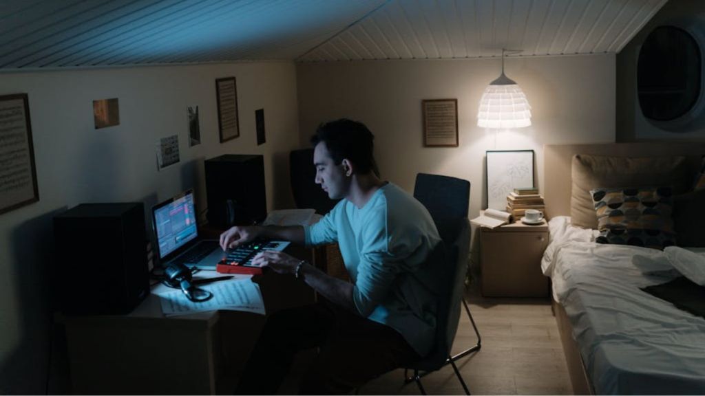 The man is working on the computer