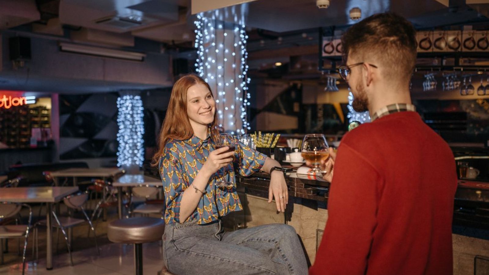 Server Thought These Late Night Diners Would Ruin His Night. He Was Dead Wrong. Man and woman having drinks at an empty bar
