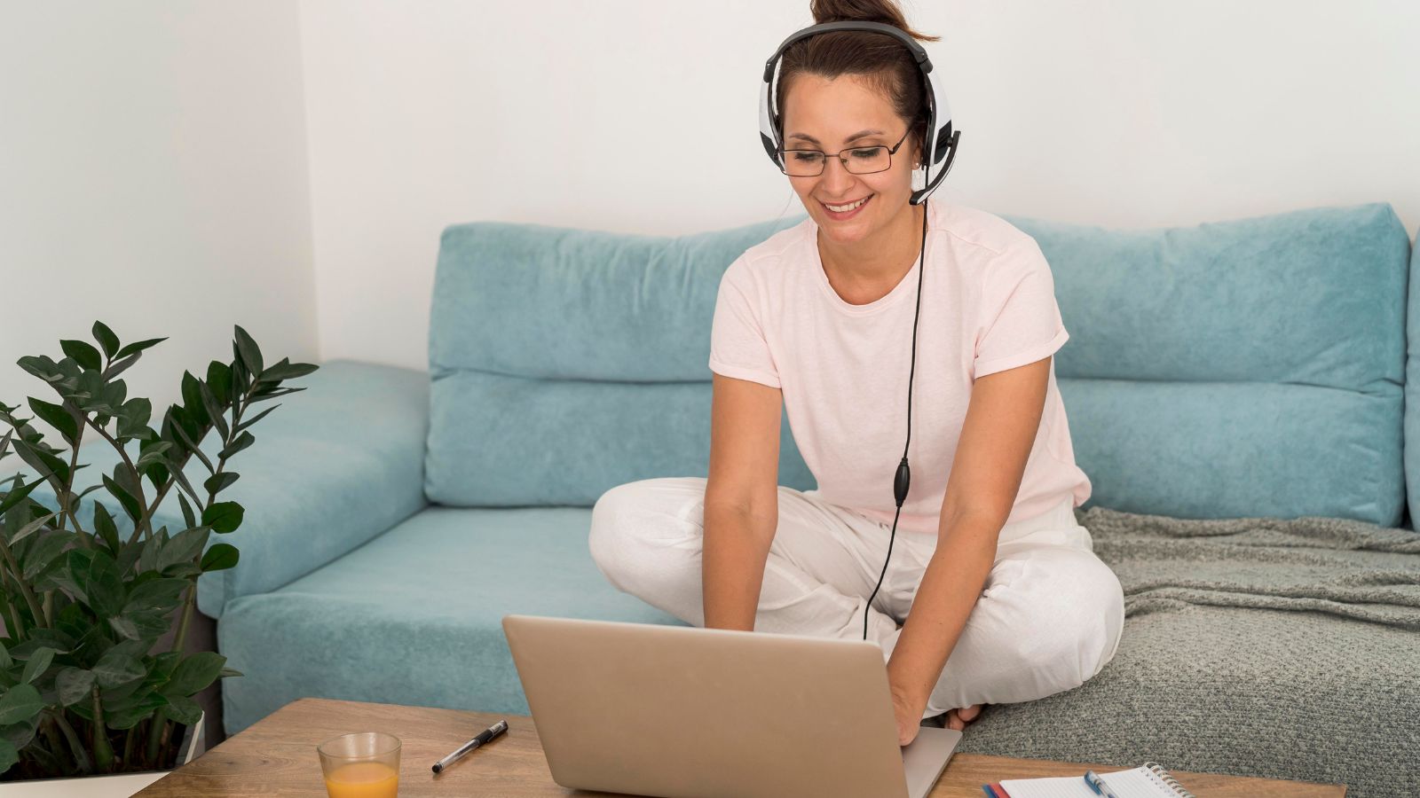 Mom Tries to Guilt Trip Daughter Into Doing Her Schoolwork While She Focuses on Travel Woman smiling in front of her laptop at home