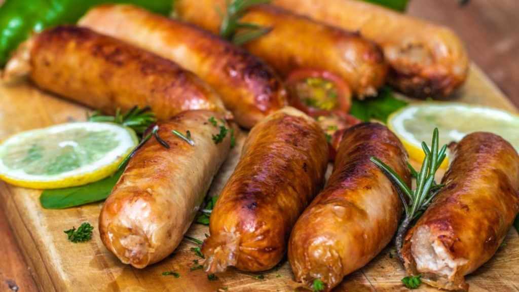 A platter of delicious sausages on the table