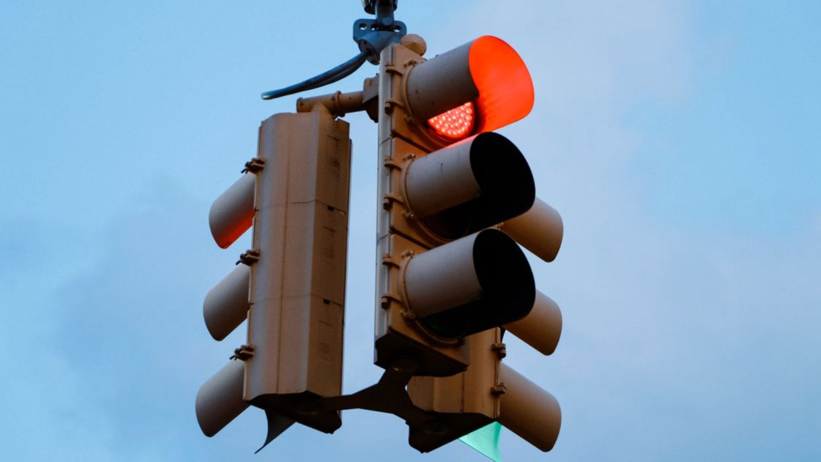 Passenger Settles Into Window Seat, Then Seatmate Starts Complaining About Her Music While Eating Egg Salad Red light on at a road traffic light