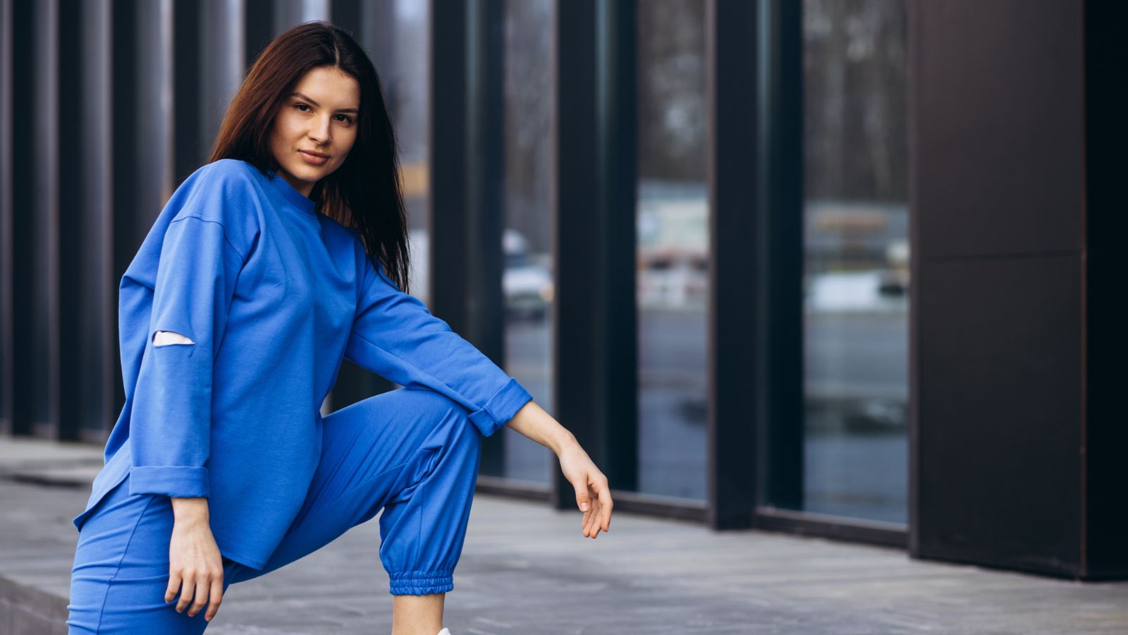 Woman in matching blue pants and jacket