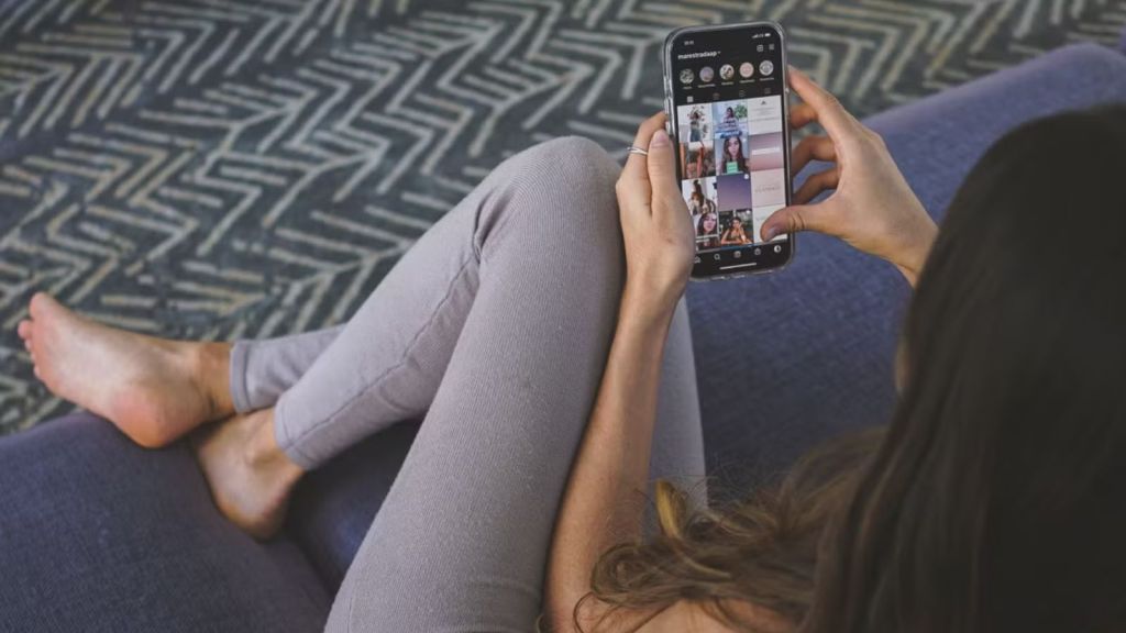Woman browsing through Instagram on her phone