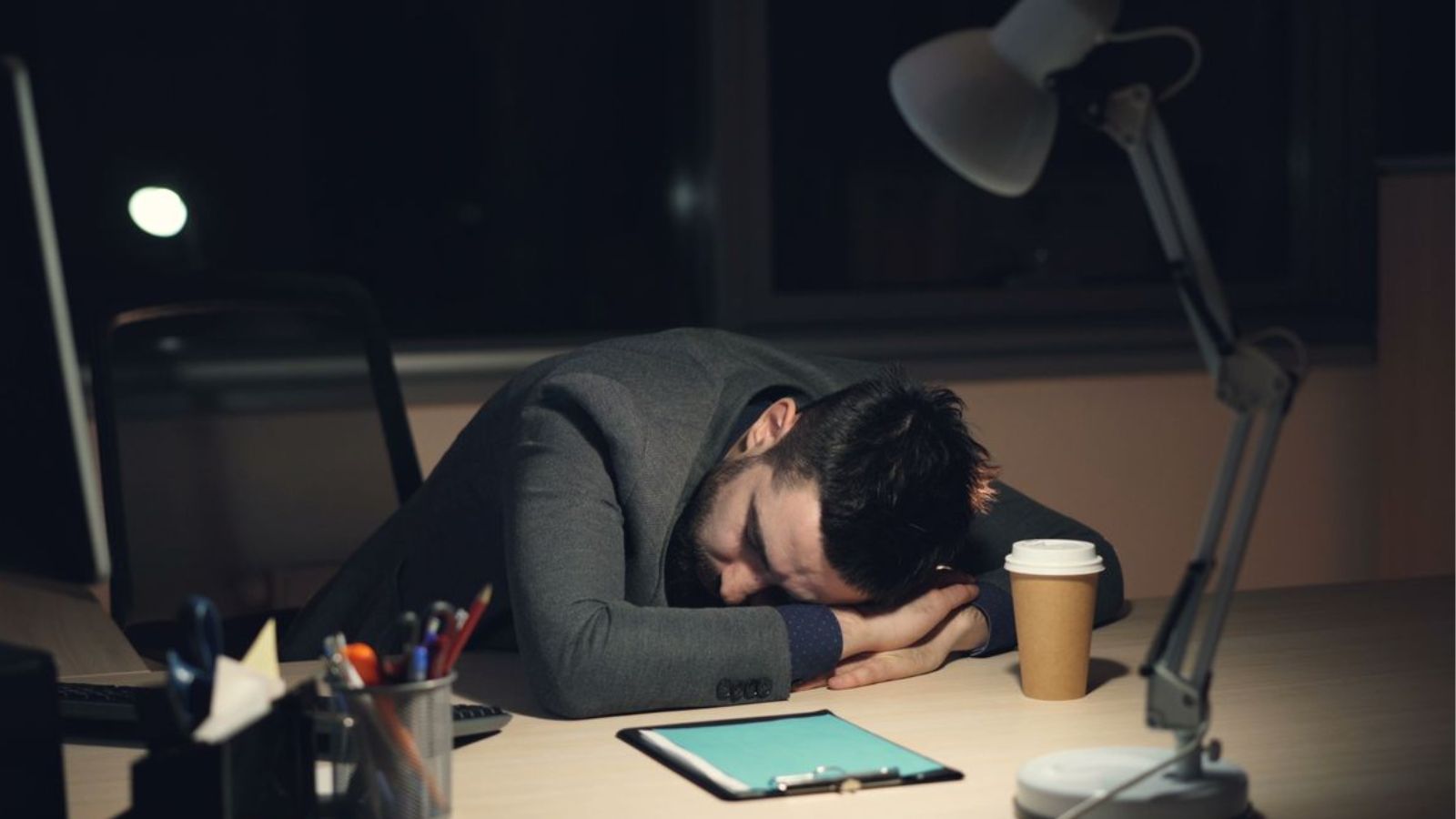 A Hotel Manager Details the Devastating Reality of Burnout: I Felt Unable to Escape Tired employee resting his read on the desk